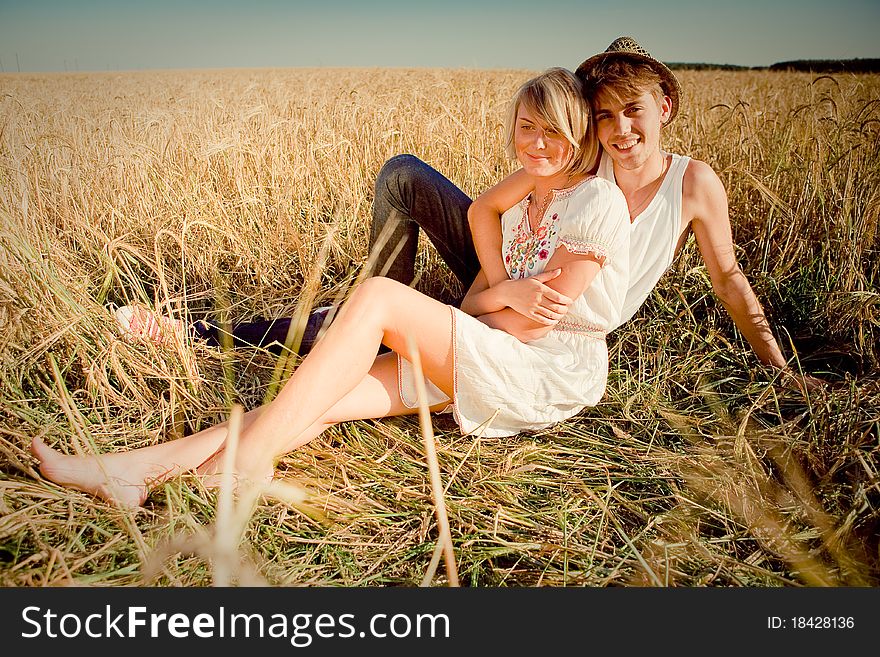 Image of young man and woman on wheat field