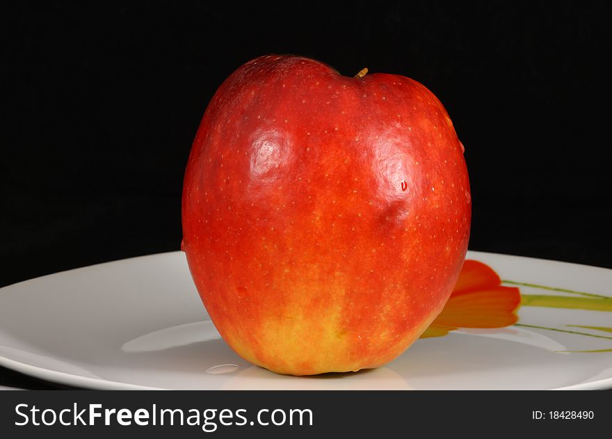 One organically grown apples isolated on Black