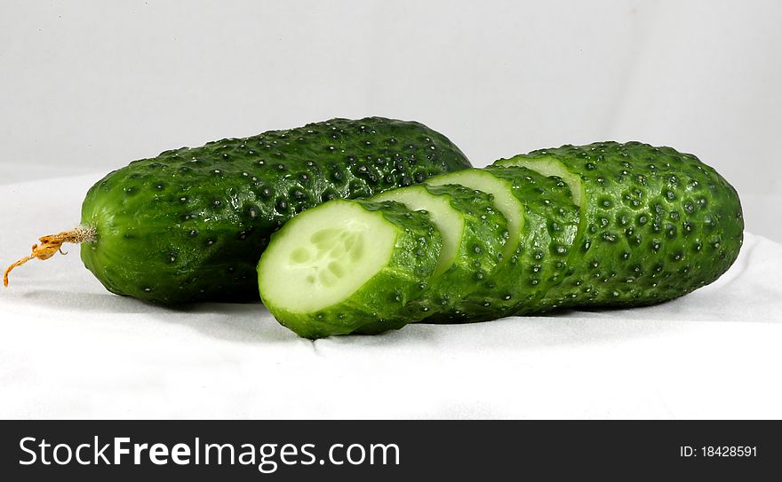Fresh green cucumber isolated on white.