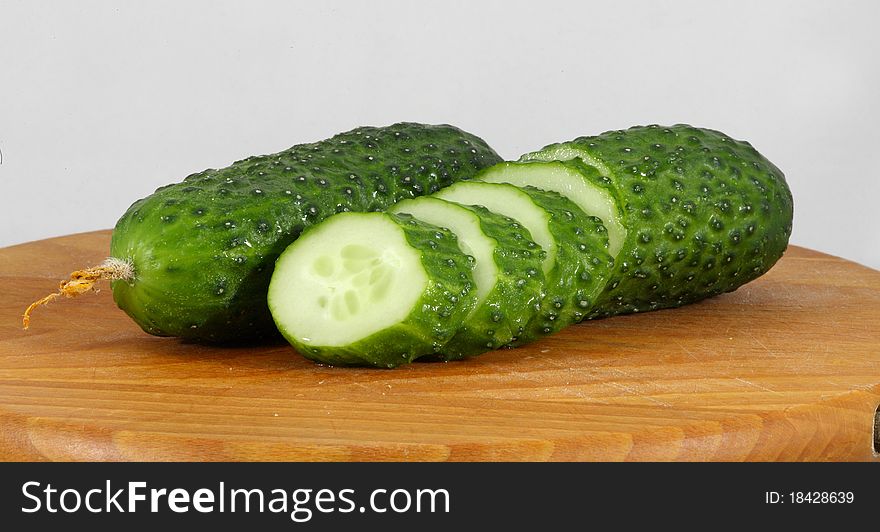 Fresh green cucumber isolated on white.