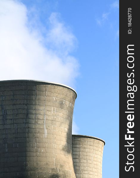 A close up shot of factory chimneys. A close up shot of factory chimneys