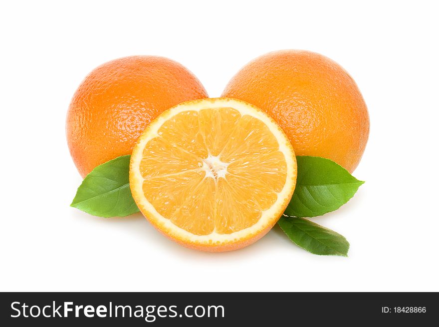 Orange half and slice with leaves isolated on white. Orange half and slice with leaves isolated on white