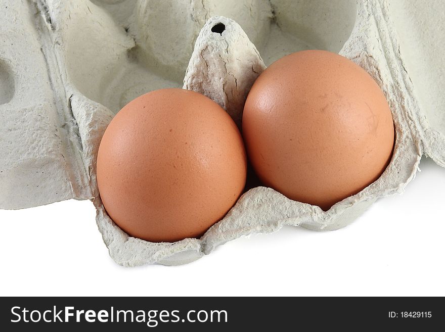 Two organic eggs isolated on white background