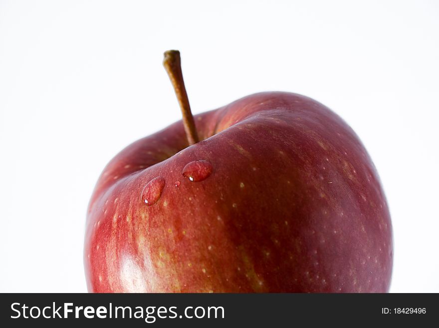 Closeup of droplet in red apple with blur effect. Closeup of droplet in red apple with blur effect