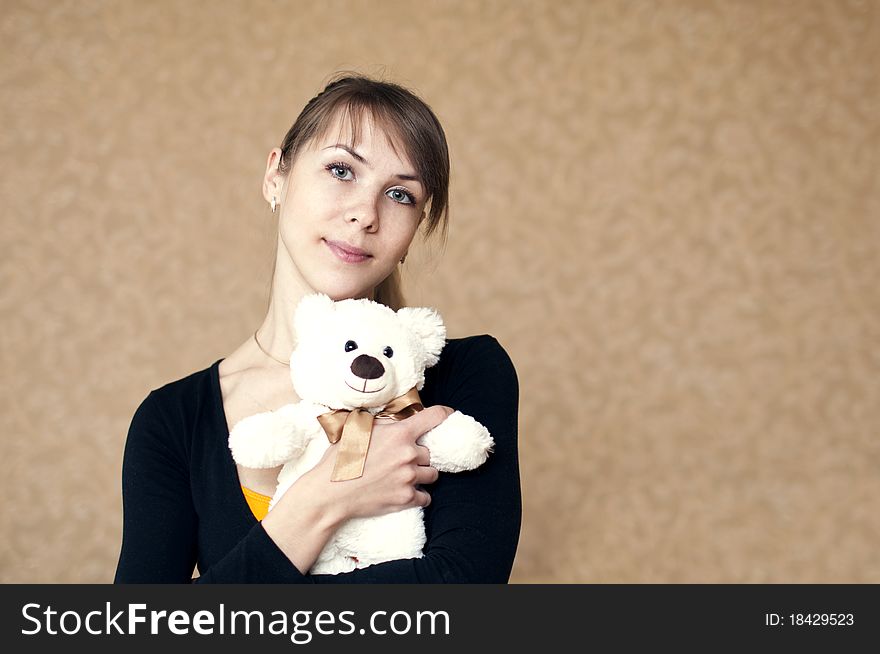 Portrait of a woman with a toy bear