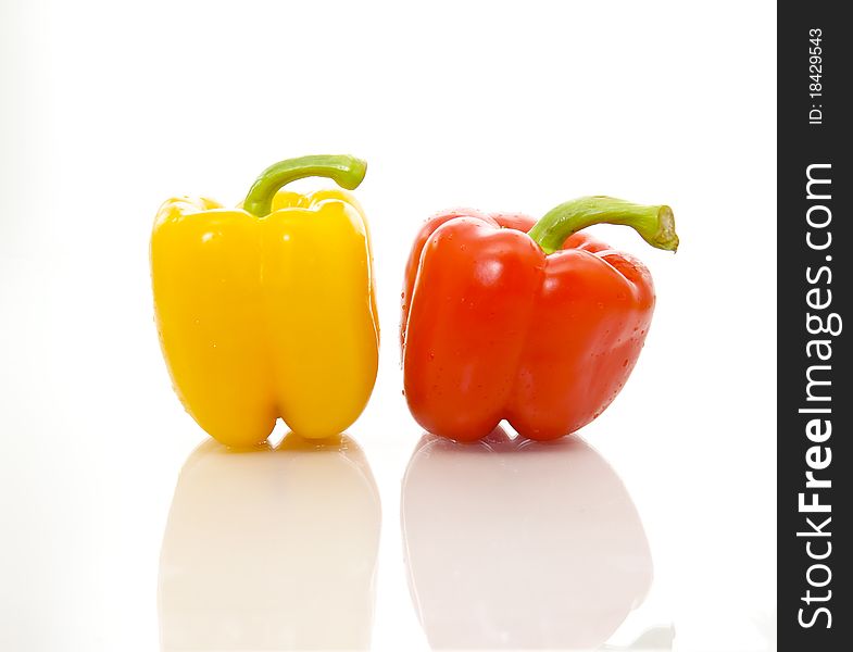 Isolated image of organic and healthy red and yellow bell peppers.