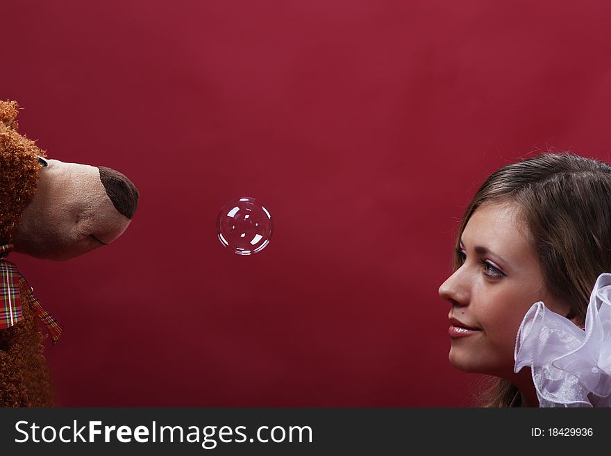 Young pretty girl play with a soap bubbles. Young pretty girl play with a soap bubbles