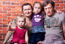 Happy Seniors Couple With Grandchildren Stock Photography