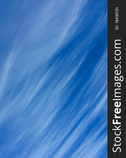 Wispy clouds on a deep blue sky