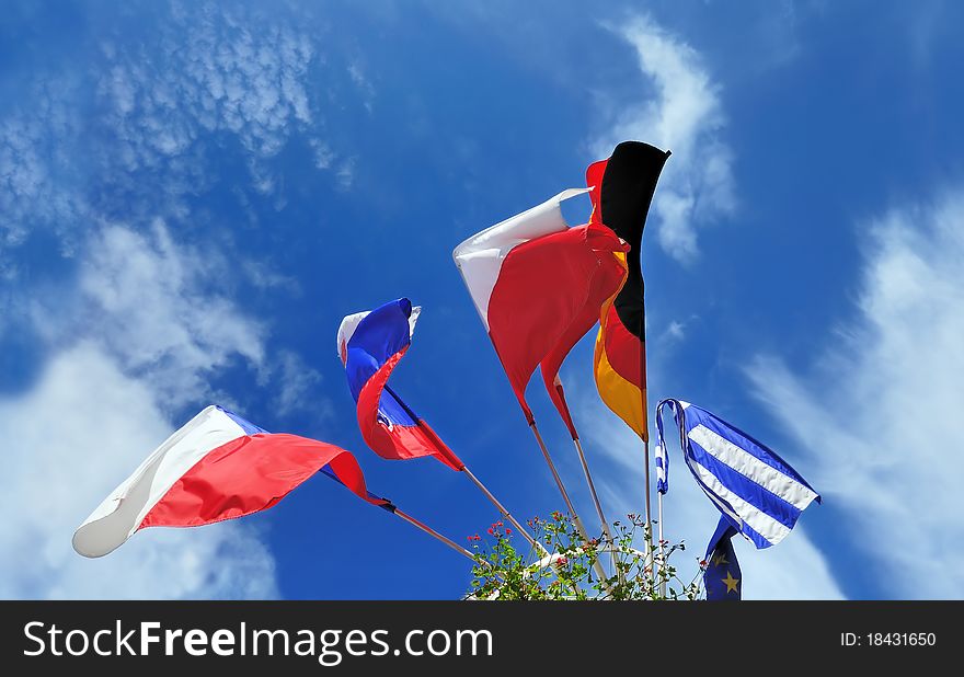 Flags of several Europe states against picturesque cloudy sky. Flags of several Europe states against picturesque cloudy sky