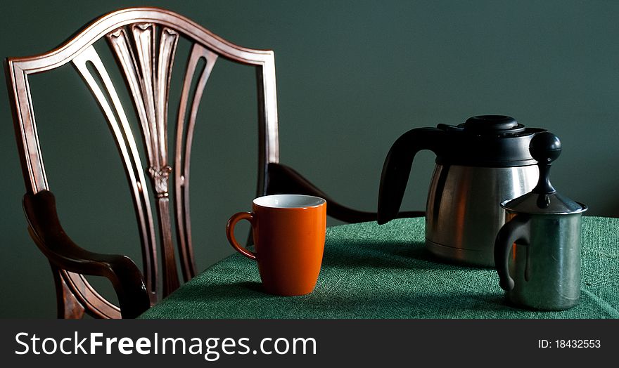 Elegant chair, coffee mug, coffee thermos, milk frother. Elegant chair, coffee mug, coffee thermos, milk frother