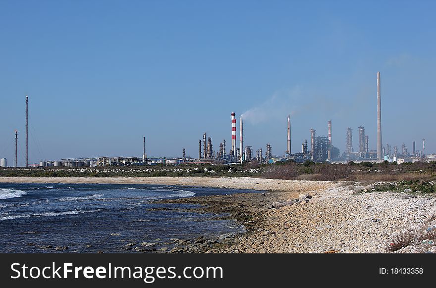 Oil Refinery Plant By The Sea