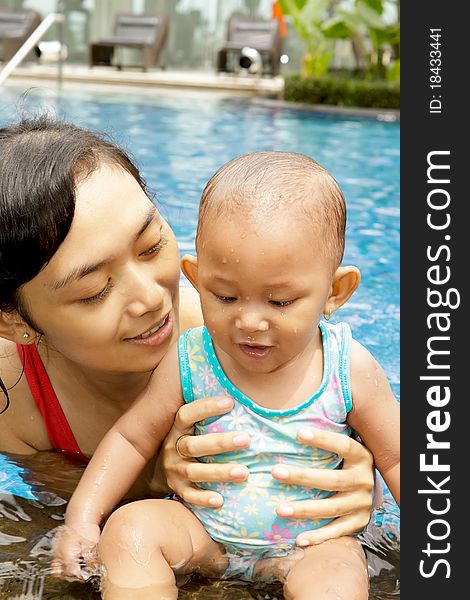 Mother And Baby At Swimming Pool