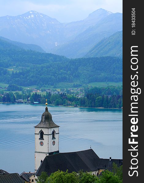 Mountain lake St Wolfgang with church in Salzkammergut, Austria. Mountain lake St Wolfgang with church in Salzkammergut, Austria