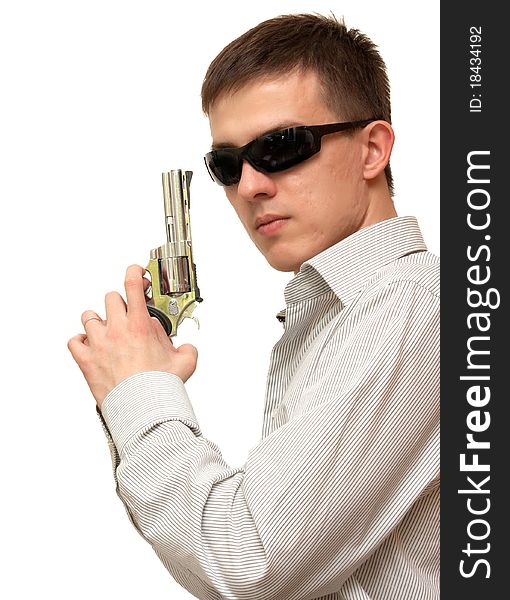 A guy with a gun in his hand wearing sunglasses on a white background