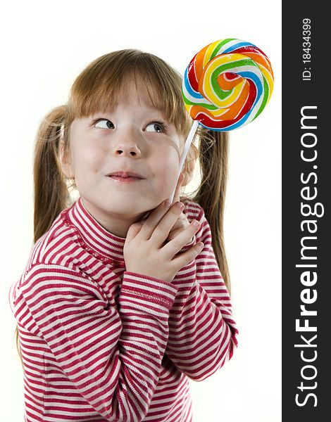 Little girl eating a lollipop