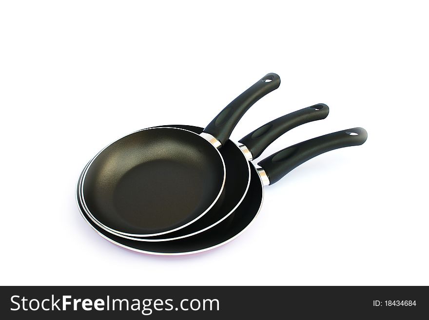 Three pans isolated on white background.