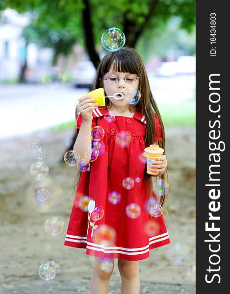 Beauty Little Girl With Long Hair And Bubbles