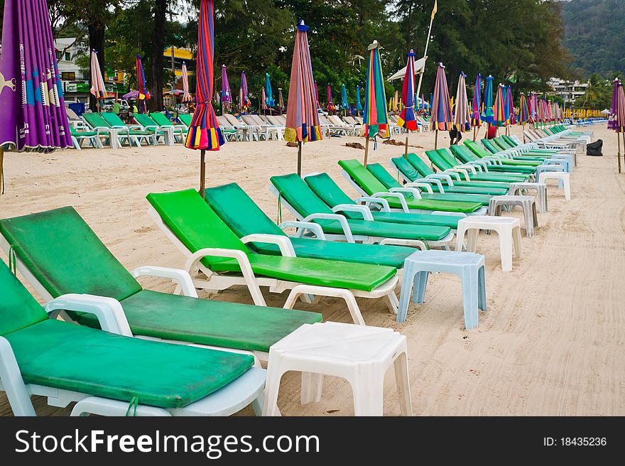 Empty chaise lounges on a beach
