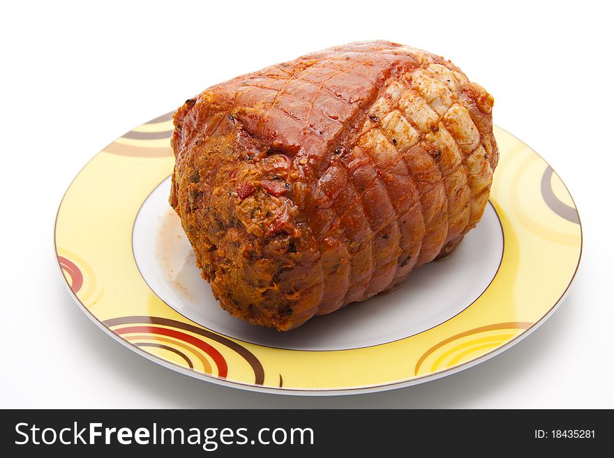 Pigs rotation roasts raw and seasoned onto plates