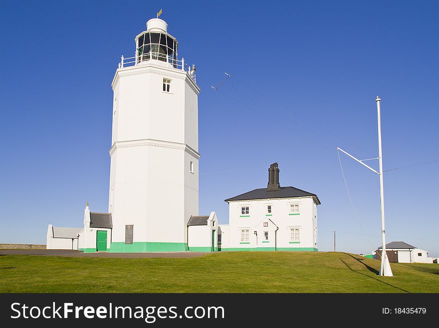 White light house on a sunny day