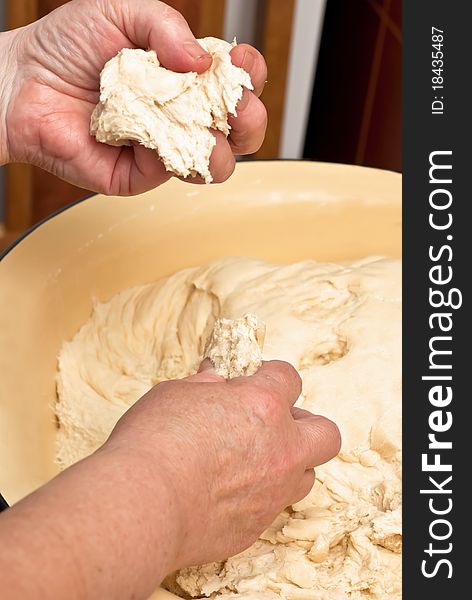 Female hands making dough. Indoor shot