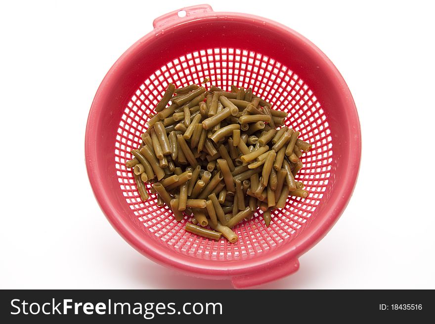 Cut green beans and in the kitchen sieve
