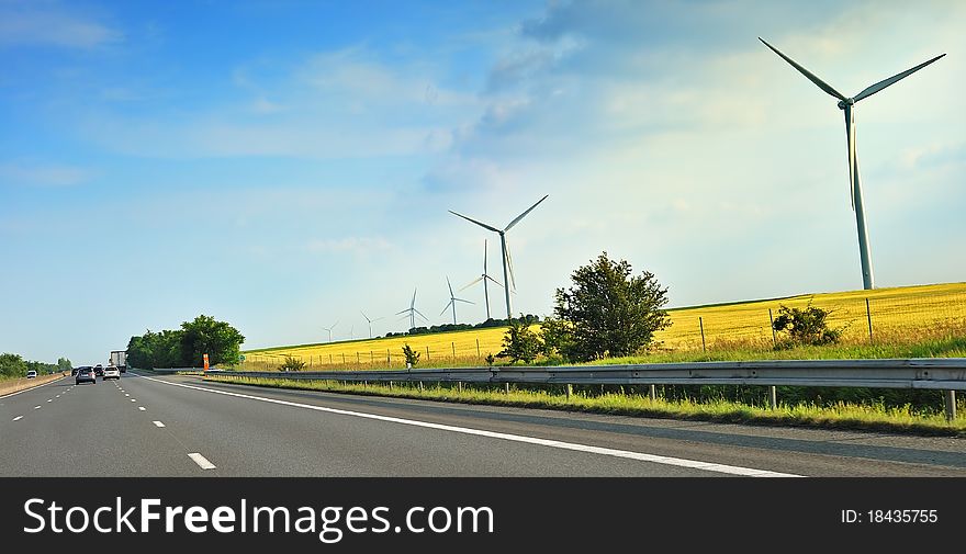 Wind turbines along a freeway