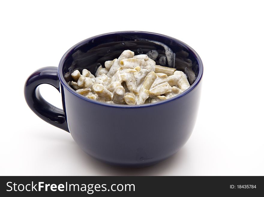 French bean salad in blue ceramic cup