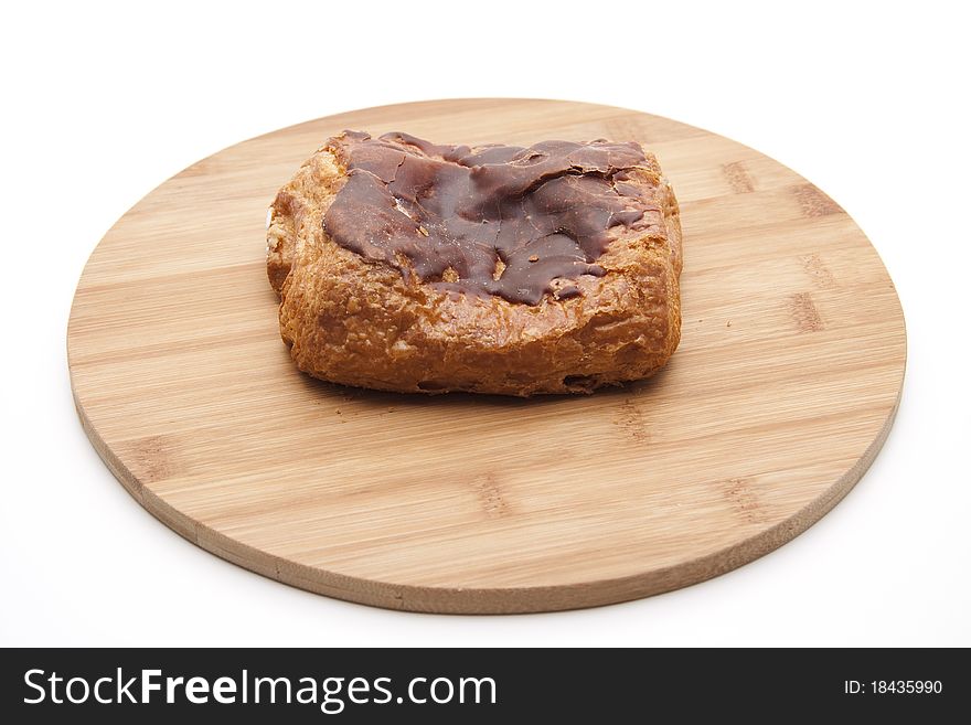 Pastry with chocolate onto wood plates