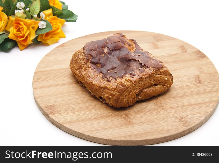 Pastry with chocolate onto wood plates. Pastry with chocolate onto wood plates