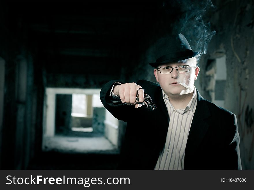 Gangster With Pistol In Abandoned House Background