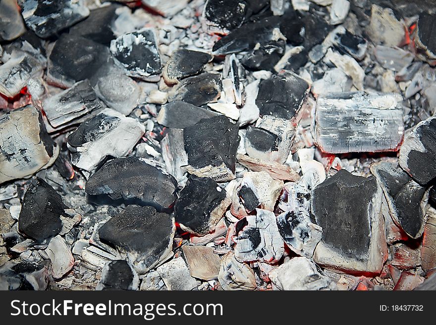 Decaying coals for cooking and a background
