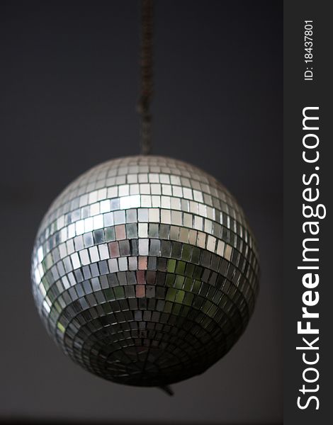 Image of the mirror  ball on a gray ceiling