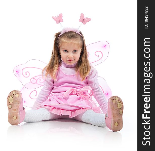 Little girl in fairy costume on white background