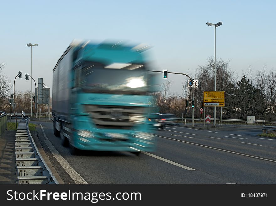 Truck moving at high speed on a country road. Truck moving at high speed on a country road