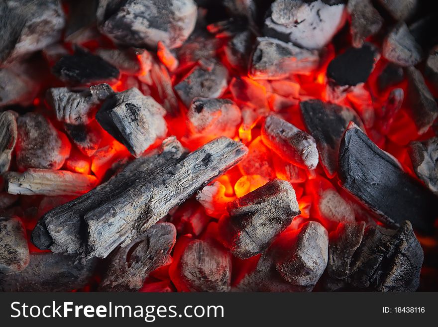 Decaying coals for cooking and a background