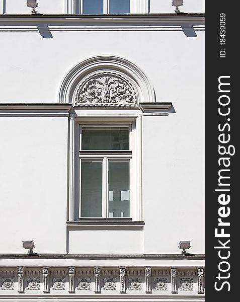 View of  closed window with pattern on  wall of ancient buildings, Russia.