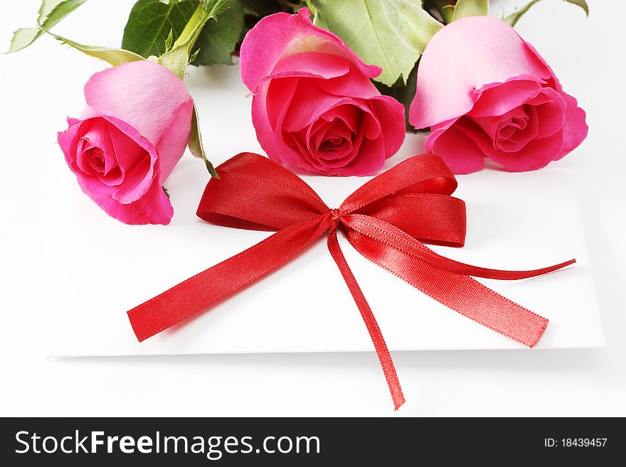 Card and roses, isolated on white background. Card and roses, isolated on white background