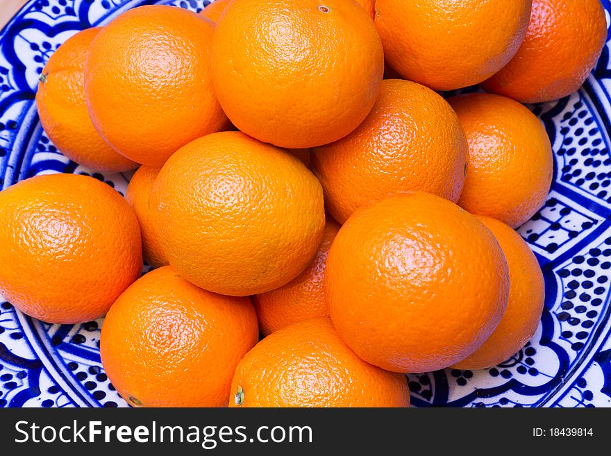 Fresh Oranges in a bowl on a table