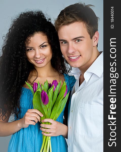 Young couple over blue background