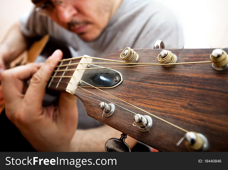 Close up on man's hands playing guitar. Close up on man's hands playing guitar