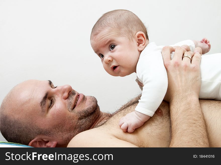 Adorable baby with father isolated