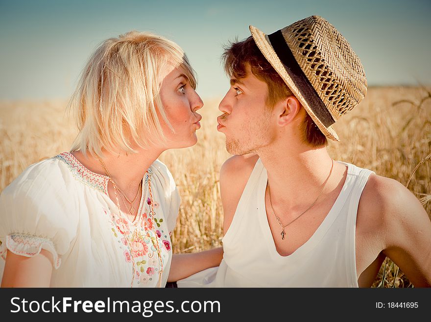 Image of young man and woman on wheat field