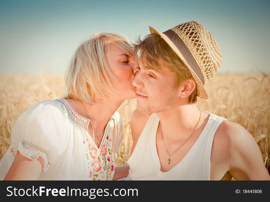 Image of young man and woman on wheat field