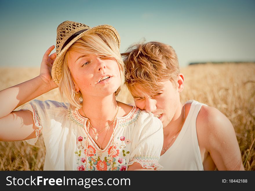 Image of young man and woman on wheat field