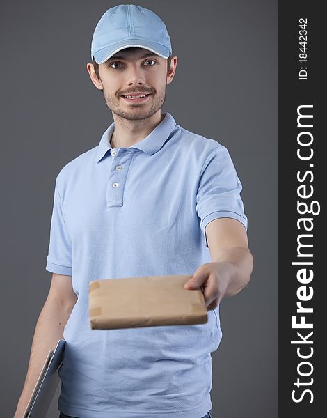 Delivery courier with small package in his hand