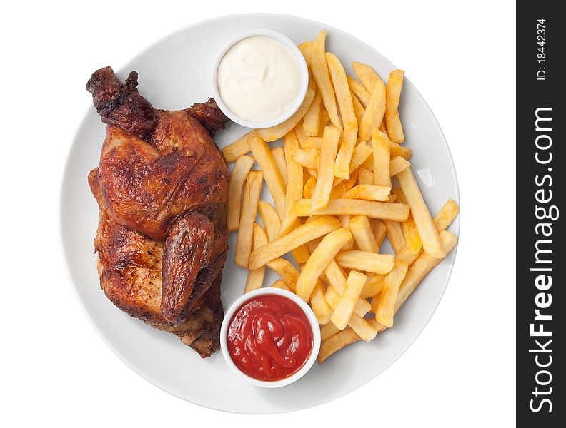Half roasted chicken and french fries with ketchup and mayonnaise