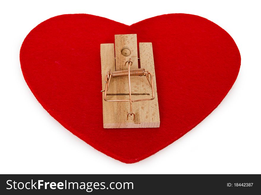 Mousetrap on red heart isolated on white background. Mousetrap on red heart isolated on white background