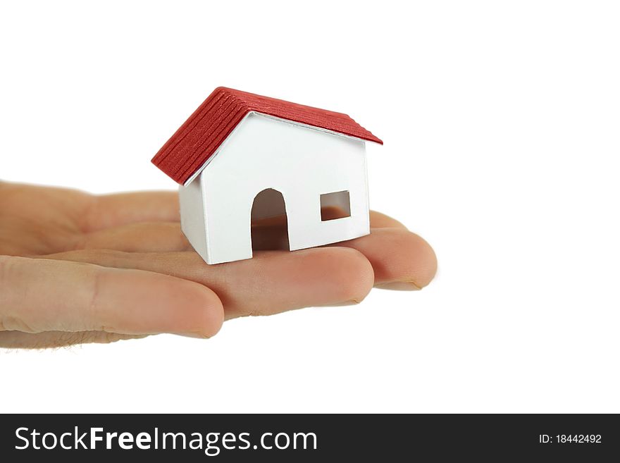 Human holding little paper model of village house, isolated. Human holding little paper model of village house, isolated